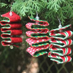 three ornaments hanging from a christmas tree