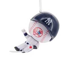 a baseball ornament hanging from a string