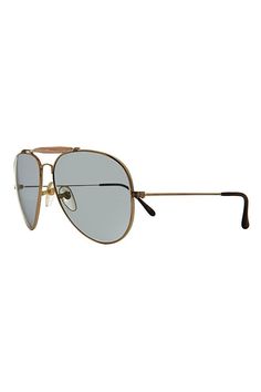 These iconic pilot sunglasses feature a teardrop metal frame with brow bar and transitioning glass Corning lens. Prescription friendly frame. **Dimensions** * 60mm Eye Size * 18mm Bridge * 135mm Temple/Arm * 5 1/2” Width * 2 1/8” Height | Vintage Bud Sunglasses Selected by Sunglass Museum at Free People in Gold Classic Aviator Shield Sunglasses With Metal Frame, Vintage Aviator Sunglasses With Mirrored Lenses, Retro Aviator Sunglasses With Metal Frame, Classic Gold Tinted Sunglasses, Vintage Gold Rectangular Sunglasses, Vintage Gold Sunglasses With Uva Protection, Adjustable Gold Metal Frame Sunglasses, Gold Aviator Sunglasses With Anti-reflective Coating For Outdoor, Brow Bar