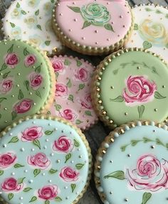 several decorated cookies sitting on top of each other