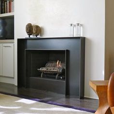 a fire place in the middle of a living room