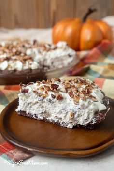 two pieces of cake sitting on top of a wooden plate