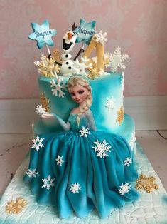 a frozen princess cake with snowflakes on it