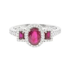 an oval ruby and diamond ring with three smaller stones on the band, set in white gold