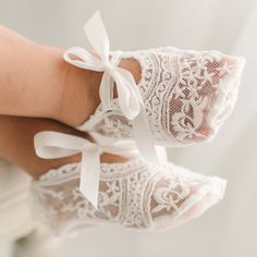 Light ivory sheer lace baby girl booties with light ivory silk ribbon ties on the feet of a baby. Elegant White Booties For Spring, Elegant White Spring Booties, Elegant Wedding Booties With Round Toe, Spring White Booties As Gift, Elegant Lace-up Booties For Spring, Elegant White Booties With Round Toe, Elegant White Round Toe Booties, Crib Shoes Girl, Blessing Gown