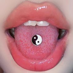 the tongue has a yin - yang ball on it