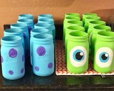 there are many mason jars with eyes painted on them