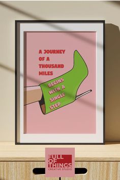 a poster on a shelf that reads a journey of a thousand miles begins with a single step