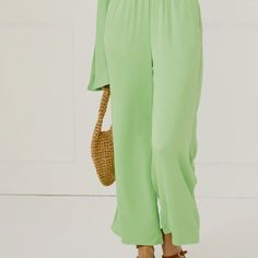 The Silky Wide Leg Pants In Green Are A Go-To For An Effortless Spring Or Summer Look. Available In A Wide Range Of Colors, This 100% Viscose Pull-On Pant Has A Wide Leg, Cropped Detailing, Side Pockets, And Elasticated Waistband. The Relaxed Silhouette Offers Comfortability, Yet Its Material Feels Sophisticated And Elevated. Wide Leg Solid Color Jumpsuits And Rompers For Loungewear, Spring Stretch Trousers Jumpsuits And Rompers, Spring Stretch Jumpsuits And Rompers Trousers, Spring Stretch Jumpsuits And Rompers, Green Solid Color Wide Leg Summer Pants, Green Solid Color Wide Leg Pants For Summer, Summer Wide-leg Jumpsuits And Rompers In Solid Color, Summer Green Wide Leg Pants, Summer Solid Color Wide-leg Jumpsuits And Rompers