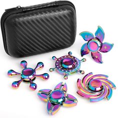 a set of colorful metal fidgets next to a black case