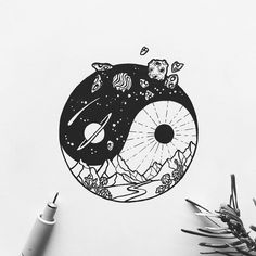 a black and white photo of a yin yang symbol with mountains, planets and stars