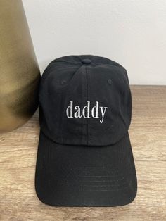 daddy dad hat, with white embroidered font. 100% cotton, adjustable fit. One size fits most. Trendy Dad Hat With Letter Print, Cotton Dad Hat With Letter Print, Father's Day Casual Adjustable Snapback Hat, Trendy Letter Embroidery Dad Hat, Casual Dad Hat With Letter Embroidery For Streetwear, Adjustable Cotton Dad Hat With Letter Print, One Size Fits Most Dad Hat For Father's Day, Trendy Everyday Dad Hat With Letter Print, Adjustable Dad Hat Baseball Cap For Father's Day