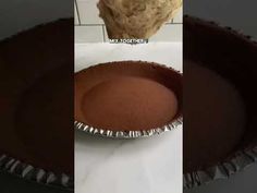 three different pictures of a pie pan with chocolate cake in the bottom and on top