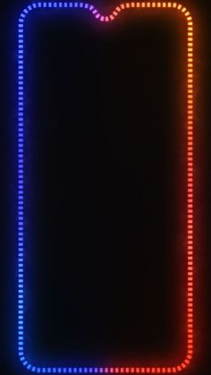 an illuminated square frame on a black background with red, blue and green lights in the middle