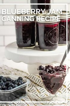 blueberry jam canning recipe in glass jars with spoons and bowl full of berries