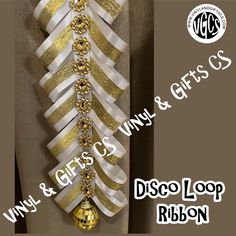 a white and gold ribbon is hanging on a wall with the words disco loop ribbon