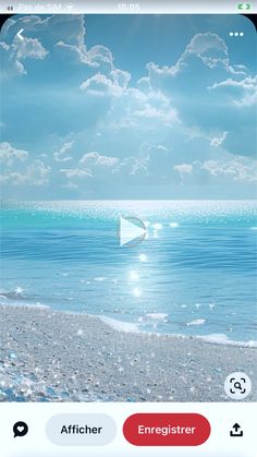 an image of the ocean with clouds in the sky and water on the beach below