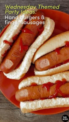 two hot dogs on buns with ketchup and relish sitting on a plate