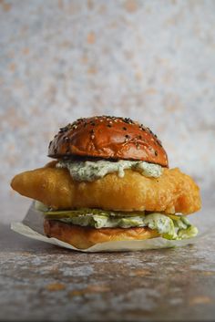 a chicken sandwich with lettuce and mayonnaise