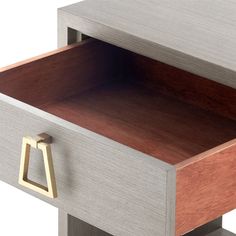 the drawer is open and there is a wooden handle on one side of the drawer