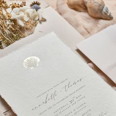 the wedding stationery is laid out and ready for guests to arrive