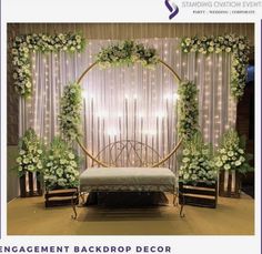 an event backdrop with white flowers and greenery