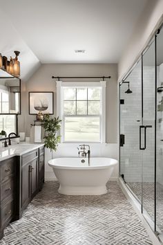 a bathroom with a tub, sink and shower in it