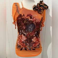 Save The Queen Top Shirt Blouse Nwt Size M Orange Multicolored Floral Decorative Top Casual Orange Blouse With Graphic Print, Fitted Orange Floral Print Tops, Orange Graphic Print Top For Summer, Summer Orange Tops With Graphic Print, Orange Floral Print Tops For Summer, Fitted Orange T-shirt For Spring, Orange Short Sleeve Blouse For Fall, Fitted Orange Tops With Graphic Print, Fitted Burnt Orange Top For Summer