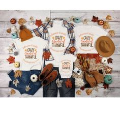 two t - shirts with the words your image is central and an orange hat sits next to it