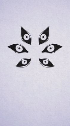 an image of four eyes in the middle of a white paper sheet with black ink on it