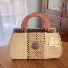 a purse sitting on top of a wooden table