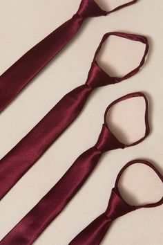 three ties laid out on a white surface