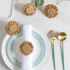 a place setting with plates, silverware and napkins