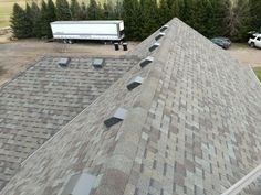 a truck is parked on the roof of a house