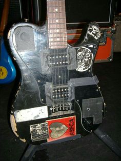 an electric guitar that is sitting on a stand