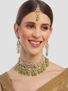 This jewelry set consists of a necklace, a pair of earrings The gold-plated necklace, has lime green stone and white kundan studded detail Secured with a drawstring closure A pair of matching drop earrings, each secured with post and back closure Comes with matching maang tikka Size & Fit Dimensions: Necklace: 23cm x 2.5cm (Length x Width) Earrings: 7cm x 2.5cm (Length x Width) Maangtikka: 7cm(Length) Material & Care Material: Alloy Plating: Gold-Plated Stone Type: Kundan Wipe with a clean cotton swab when needed Green Stone Work Bridal Necklace, Adjustable Green Jewelry For Diwali, Green Jeweled Kundan Necklace For Party, Bollywood Style Green Jeweled Necklaces, Diwali Green Jeweled Necklaces, Green Jeweled Bridal Necklace For Festive Occasions, Festive Green Jeweled Jewelry Sets, Festive Jeweled Green Bridal Necklace, Festive Green Jeweled Bridal Necklace