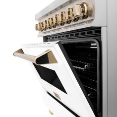 an oven with the door open and gold knobs on it's front doors