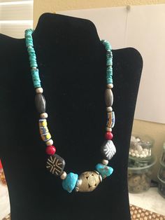 ** PLEASE READ EVERYTHING BEFORE YOU PURCHASE ** Hand made  pretty  NECKLACE with multiple vintage beads such as Kingman turquoise, African trade beads, agate beads, coral beads, silver beads, Asian wood beads, and other kind of turquoise beads. With an unique by my self I believe it is a nice gift for yourself or for your loved ones. . . . . . . . . . . . . . . . . . . . . . . . . . . . . . . . . . . . . . . . . . .. . . . . . . . . . . . .  -- size of the necklace: 19.4 inches long -- size of the  beads: the biggest one is the African Brass bead, 3 cm X 2 cm; -- size of the 2 big Kingman turquoise beads: 2 cm X 1.3 cm  -- size of the 2 wood beads: 2cm X 2 cm; -- weight of the necklace: 2.76 oz For getting the 50% discount,Please send me a message before order and I will change the price Vintage Turquoise Jewelry With Colorful Beads, Unique Multicolor Beaded Turquoise Necklace, Unique Multicolor Turquoise Necklace With Colorful Beads, Southwestern Multicolor Turquoise Necklace With Large Beads, Southwestern Multicolor Large Beads Turquoise Necklace, Vintage Beaded Turquoise Necklace With Round Beads, Vintage Beaded Necklace With Gemstone Beads For Festival, Vintage Beaded Necklaces With Gemstone Beads For Festivals, Vintage Silver Beaded Necklaces With Colorful Beads