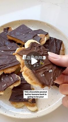 someone is holding a plate full of chocolate and peanut butter barkle cookies with text