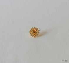 18kt traditional design gold nose stud nosepin from rajasthan india. nice design made of 18kt yellow gold, good for jewelry collection. best gift item. weight - 670 milligrams size of top - 10.4 mm material - 18kt yellow gold. Nosepin Design, Small Nose Pin Designs Gold, Gold Nose Pin Studs, Dainty Gold Round Nose Studs, Yellow Gold 22k Round Nose Ring, Gold Temple Jewelry Nose Studs As Gift, Gold Temple Jewelry Nose Rings For Puja, Indian Nose Ring Stud Gold, Elegant Yellow Gold Nose Studs