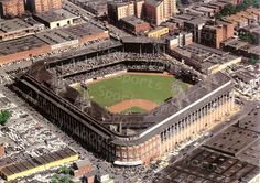 an aerial view of a baseball stadium in the middle of a city with lots of buildings