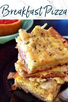 the breakfast pizza is stacked on top of each other with cheese and meat toppings