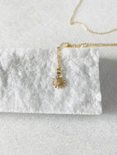 "This solid 14k gold charm is stunning and has a great detail. The slightly curved sun beams and its dome shape add dimension. The pendant measures approximately 8 mm. Now available with the 16 or 18\" dainty solid 14k gold chain. The sun will be suspended on 4 mm open bail (see 1st photo) If you only purchasing the charm, select bail size: 4 mm 14k open jump ring bail and can accommodate chains up to 1.6 mm. 6 mm 14k closed bail that can suit thicker necklaces. Hallmarked 14K 14k sand dollar ch Dainty Sun Design Jewelry For Everyday Wear, Dainty Sun Design Jewelry For Everyday, Dainty Everyday Sun Design Jewelry, 14k Yellow Gold Jewelry With Sun Design, Sun Design Pendant Jewelry As Gift, 14k Yellow Gold Sun Design Jewelry, Sun Design Pendant Jewelry Gift, Everyday Yellow Gold Jewelry With Sun Design, Everyday Yellow Gold Sun Design Jewelry