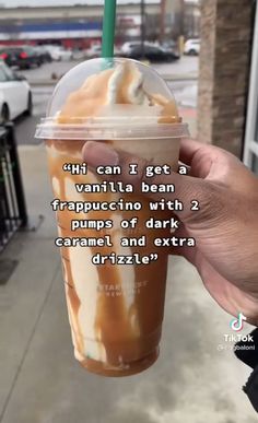 someone is holding up a cup with ice cream in it and the caption reads, i can't get a vanilla bean frapuccino with 2 pumps of dark caramel and extra