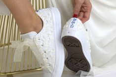 "Now all our wedding sneakers with free express shipping upgrade to USA, Canada and Europe : 2-4 business days transit time always.You can have your shoes pretty fast with guranteed transit times by DHL express. New faster production time.Everything is shipped in 1-2 weeks. Made with love for your wedding day by Lovin Bridal - More Wedding shoes at our shop : http://lovincollection.etsy.com It's the bride's prerogative to wear the comfiest wedding shoes. If you're set on heels then one option is to have your Lace Bridal Converse tennis shoes as a second pair of wedding shoes to change into for the reception. There are so many options for your wedding trainers - go for white or ivory for a twist on the traditional, or a pop of colour to make your Wedding Low Top  Converse sneakers a standou Low-top Wedding Shoes With White Laces, Lace-up Wedding Shoes For Bride, Bride Wedding Shoes With Laces And Round Toe, Round Toe Wedding Shoes With Laces For Bridal Shower, Bride's Wedding Shoes With Laces And Round Toe, Bridal Wedding Shoes With Laces And Round Toe, Lace-up Wedding Shoes With Laces For Bride, Low-top Wedding Shoes With White Laces For Bridal Shower, Low-top Lace Wedding Shoes For Bride