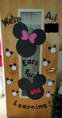 a door decorated to look like mickey mouse ears with the words ears for learning on it