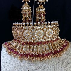 an elaborate gold and red tiara on display