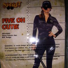 a woman in black wetsuit standing next to a poster