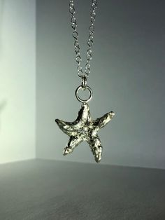 A recycled Sterling silver star gosh pendant on an 18' Sterling silver chain. Silver Starfish Charm Pendant Jewelry, Silver Starfish Charm Necklace In Sterling Silver, Ocean-inspired Sterling Silver Charm Necklaces, Sterling Silver Starfish Charm Pendant Necklace, Ocean-inspired Silver Sterling Charm Necklaces, Sterling Silver Starfish Necklace With Star Charm, Sterling Silver Necklace With Starfish Charm, Silver Starfish Necklace For Gift, Sterling Silver Pendant Necklace With Starfish Charm