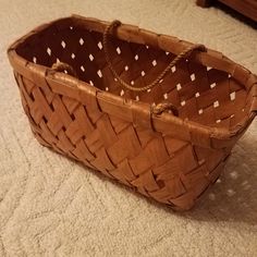 a woven basket sitting on the floor